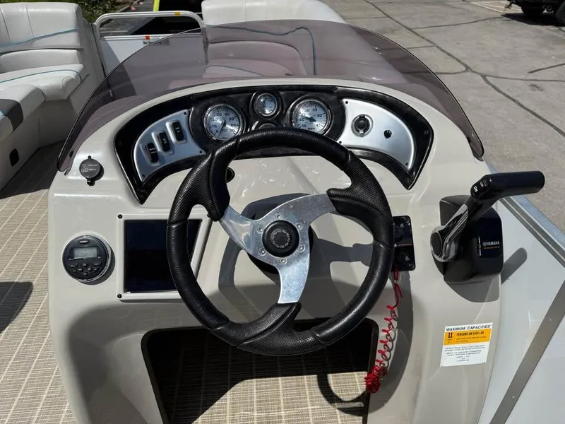 Slide: The Image of Steering console of 2018 G3 V20C boat with gauges and controls. - 9