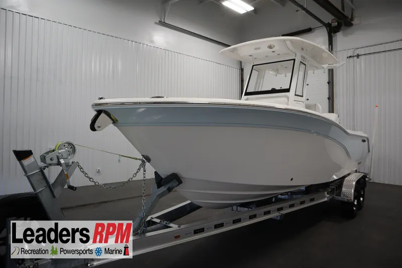 The Image of 2026 Sea Fox 248 Commander boat on trailer in indoor showroom. - 0