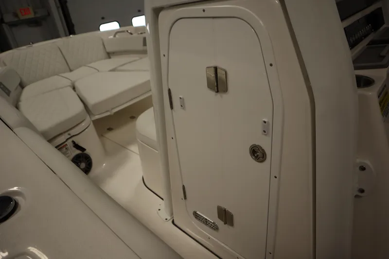 Slide: The Image of Interior view of 2026 Sea Fox 248 Commander boat with cushioned seating and storage compartment. - 20