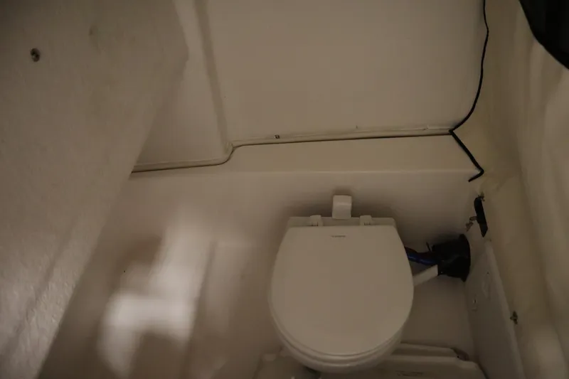 Slide: The Image of 2026 Sea Fox 248 Commander boat interior with compact marine toilet. - 21