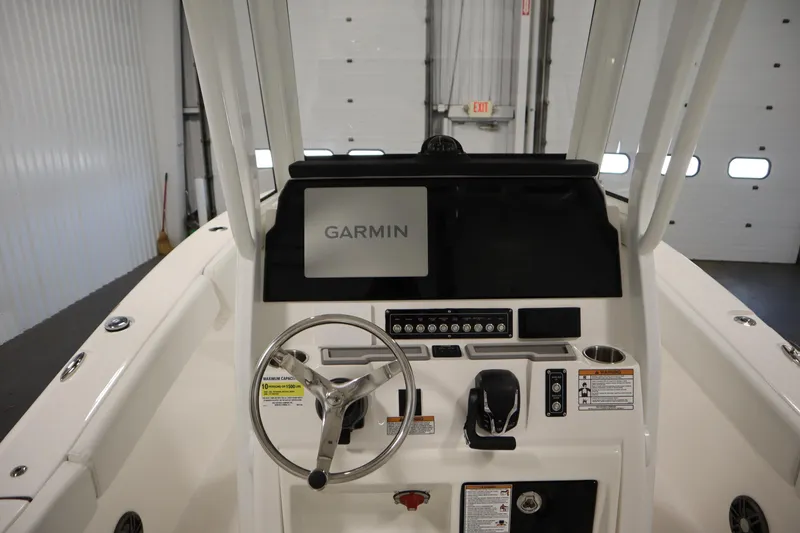 Slide: The Image of 2026 Sea Fox 248 Commander boat console with Garmin display in a showroom. - 25