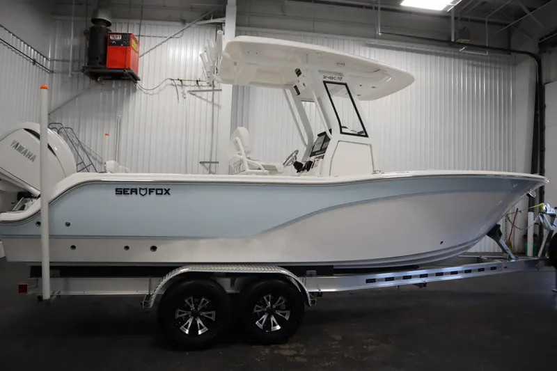 Slide: The Image of 2026 Sea Fox 248 Commander boat on trailer in indoor storage. - 3