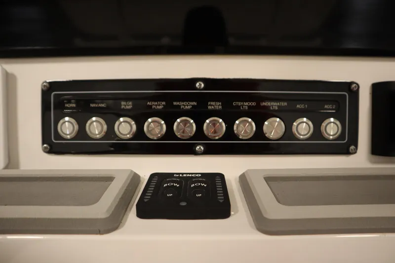 Slide: The Image of Control panel of 2026 Sea Fox 248 Commander boat with various switches and buttons. - 31