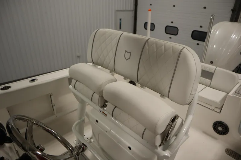 Slide: The Image of 2026 Sea Fox 248 Commander boat interior with plush white seating and steering wheel. - 38