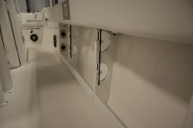 Slide: The Image of 2026 Sea Fox 248 Commander interior, showcasing rod holders and storage compartments. - 43