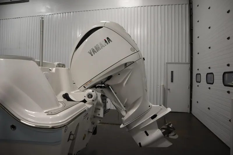 Slide: The Image of 2026 Sea Fox 248 Commander with Yamaha outboard motor in a garage setting. - 52