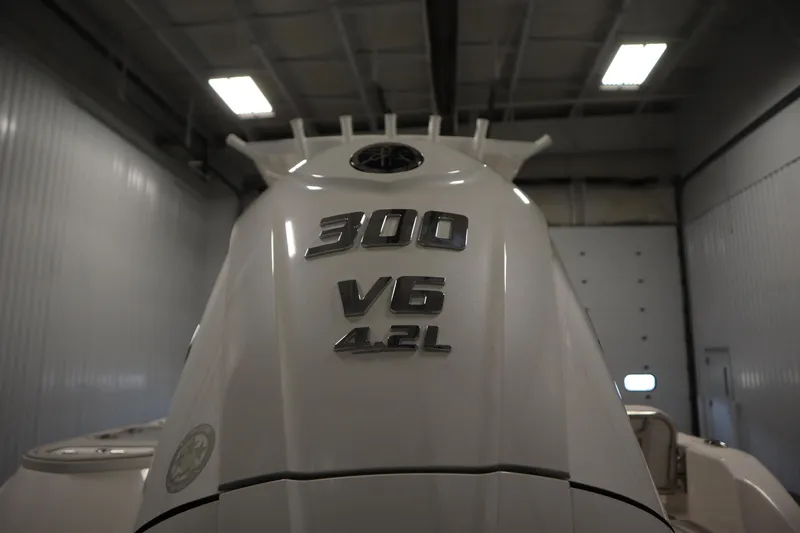 Slide: The Image of 2026 Sea Fox 248 Commander boat engine, 300 V6 4.2L, in a garage setting. - 54