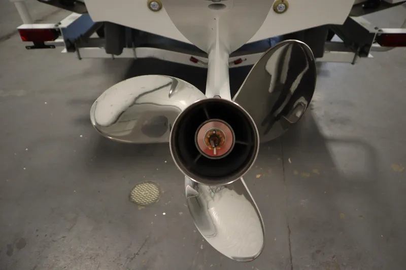 Slide: The Image of 2026 Sea Fox 248 Commander boat propeller, close-up view in a garage setting. - 55