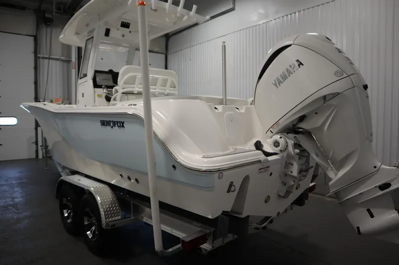 Slide: The Image of 2026 Sea Fox 248 Commander boat with Yamaha engine in indoor showroom. - 6