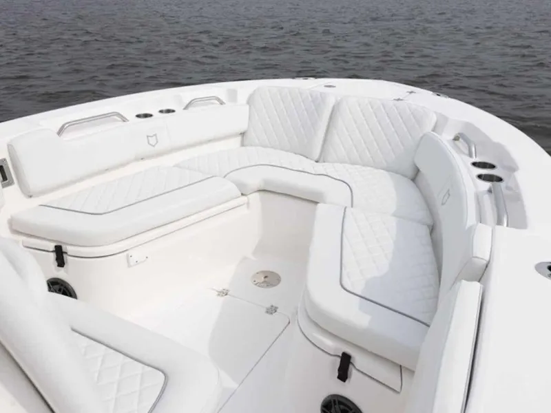 Slide: The Image of 2026 Sea Fox 248 Commander boat with luxurious white seating on calm water. - 65