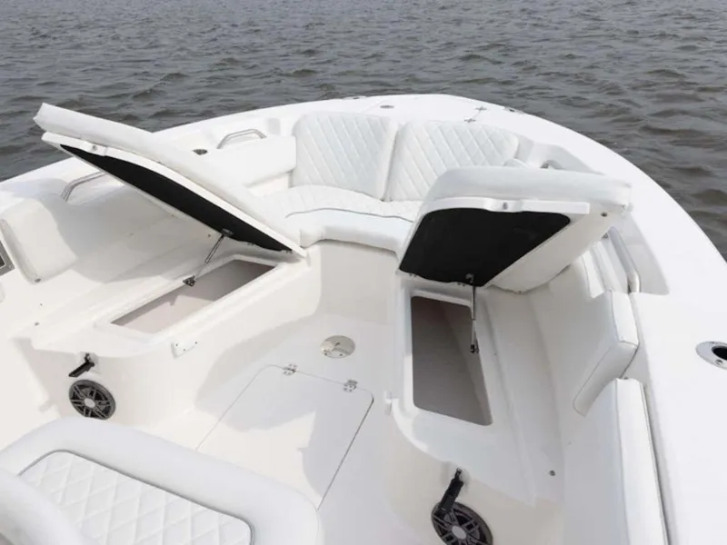Slide: The Image of 2026 Sea Fox 248 Commander boat with open storage compartments on calm water. - 68