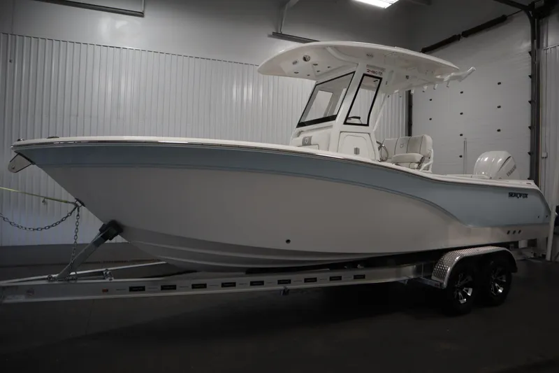 Slide: The Image of 2026 Sea Fox 248 Commander boat on trailer in indoor showroom. - 7