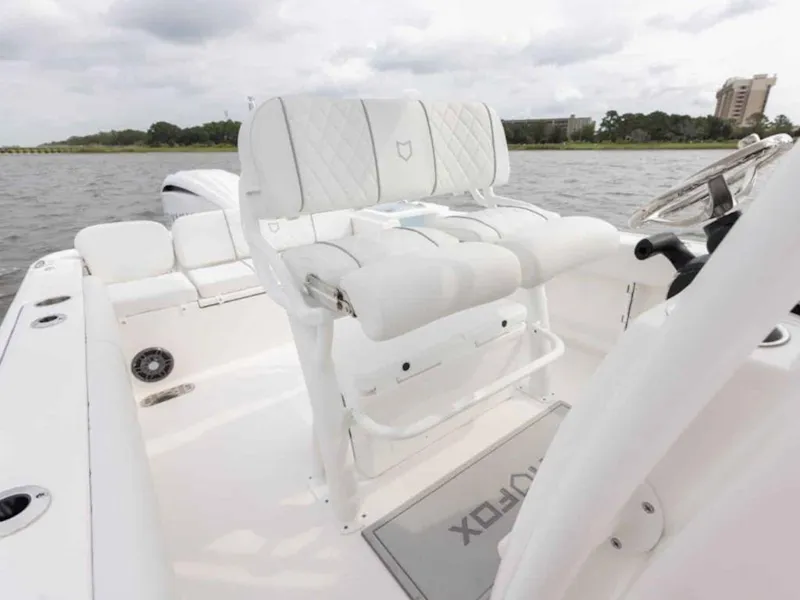 Slide: The Image of 2026 Sea Fox 248 Commander boat interior with white seating and steering wheel. - 73