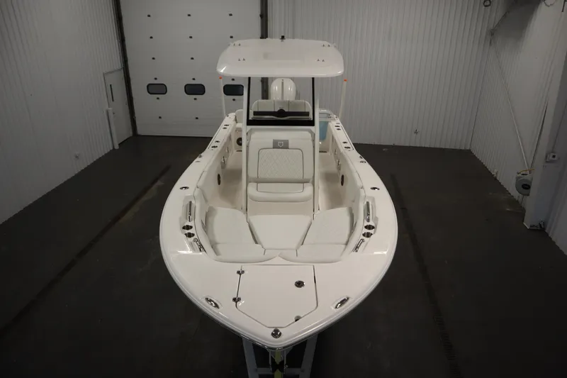 Slide: The Image of 2026 Sea Fox 248 Commander boat in indoor storage, showcasing sleek design and spacious seating. - 8
