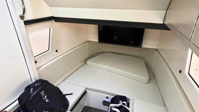 Slide: The Image of 2023 Scout 377 LXF cabin interior with seating and storage. - 19