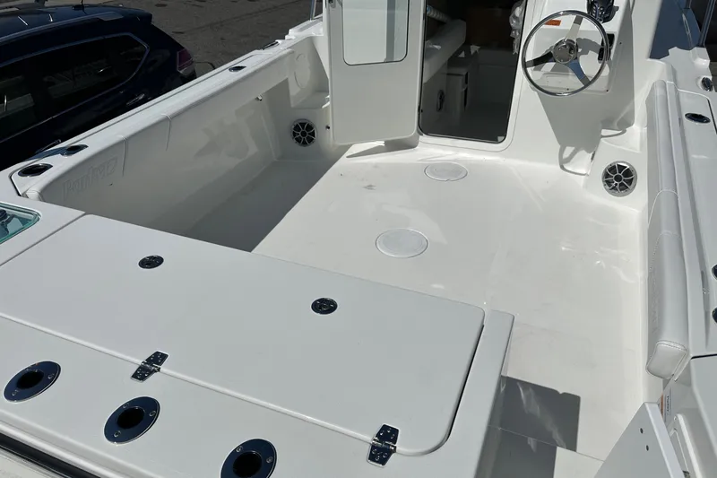 Slide: The Image of 2026 Parker 2220 boat interior with open deck and steering wheel. - 22