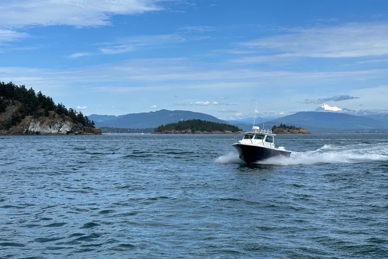 Slide: The Image of Parker 227 Explorer boat cruising on scenic waters, 2026 model. - 29