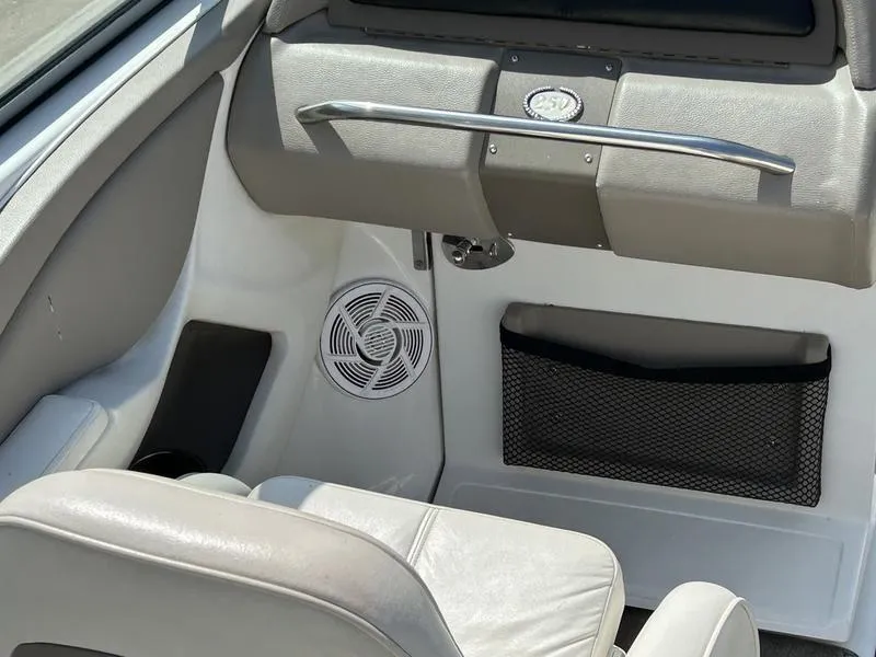 Slide: The Image of Interior of a 2006 Cobalt 250 boat, featuring seating and storage compartments. - 10