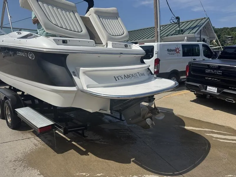 Slide: The Image of 2006 Cobalt 250 boat on trailer, rear view, with "It's About Time" text. - 15
