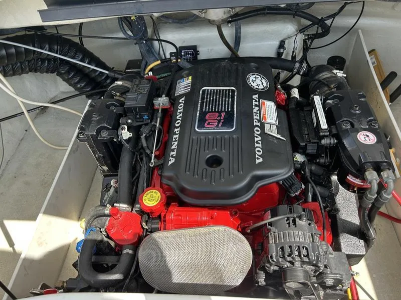 Slide: The Image of Volvo Penta engine in a 2006 Cobalt 250 boat, showcasing detailed components. - 17