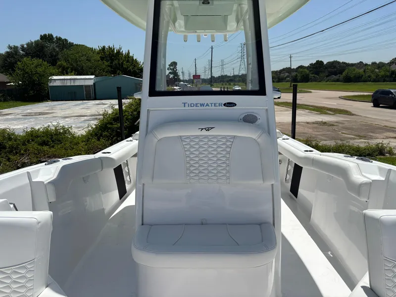 Slide: The Image of 2026 Tidewater 232 LXF boat interior with white seating and console. - 11