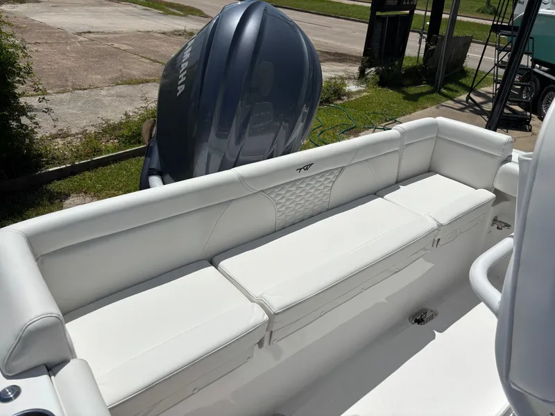 Slide: The Image of 2026 Tidewater 232 LXF boat with white seating and Yamaha outboard motor. - 4
