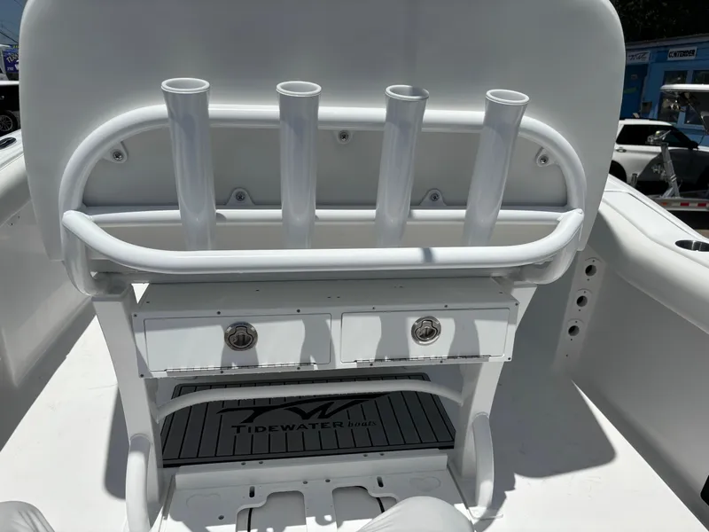 Slide: The Image of 2026 Tidewater 232 LXF boat interior with rod holders and storage compartments. - 7