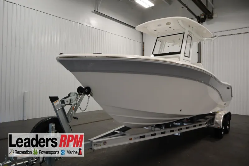 The Image of 2026 Sea Fox 228 Commander boat on trailer in indoor showroom. - 0