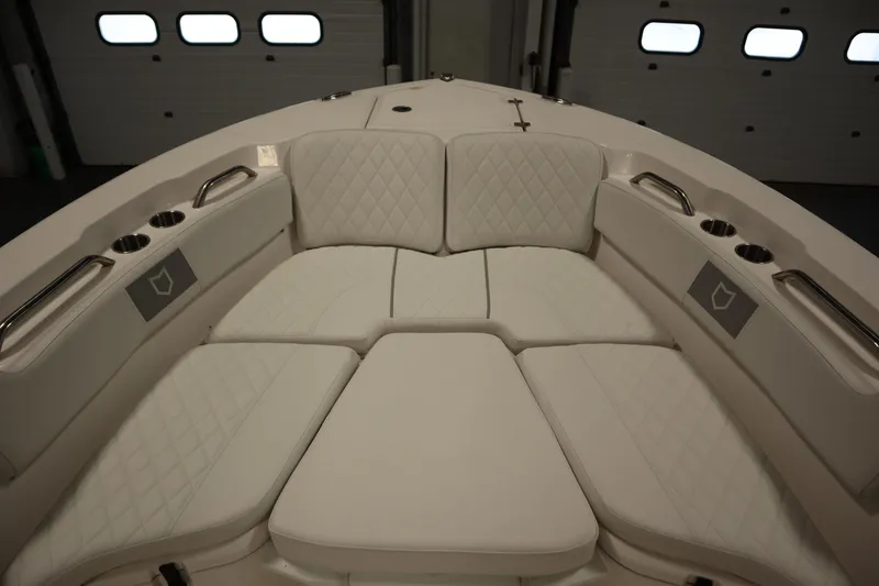 Slide: The Image of Luxurious seating area on 2026 Sea Fox 228 Commander boat, featuring quilted upholstery and cup holders. - 10