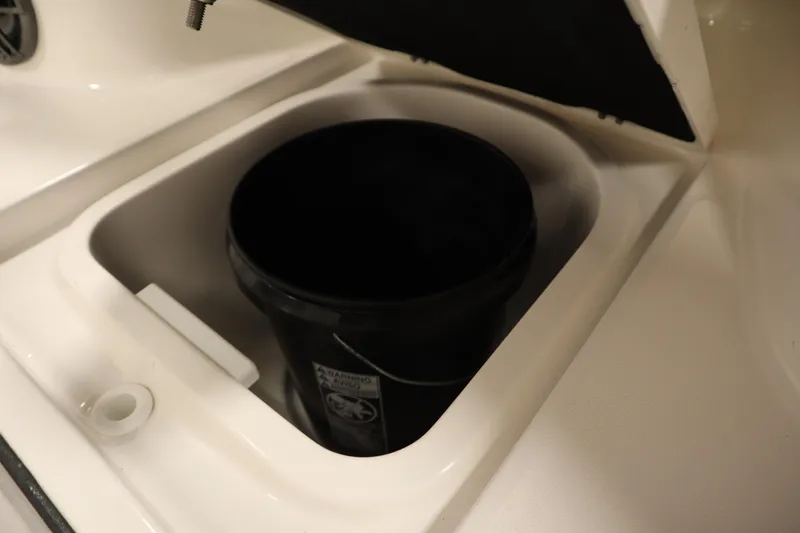 Slide: The Image of Storage compartment with black bucket in 2026 Sea Fox 228 Commander boat. - 16