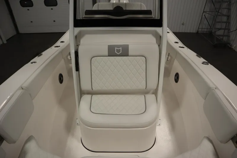 Slide: The Image of 2026 Sea Fox 228 Commander boat interior with white cushioned seating and sleek design. - 17