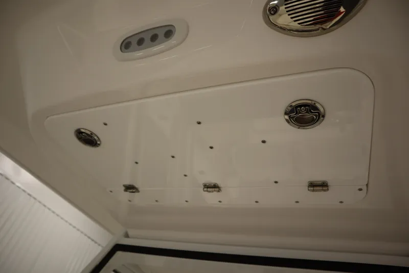 Slide: The Image of Ceiling view of 2026 Sea Fox 228 Commander boat with storage compartment and speaker. - 18