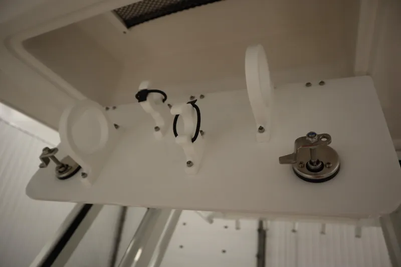 Slide: The Image of 2026 Sea Fox 228 Commander boat interior detail with white fittings and metal latch. - 19