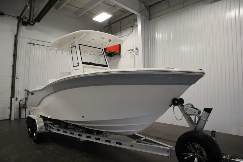 Slide: The Image of 2026 Sea Fox 228 Commander boat on trailer in indoor storage facility. - 2