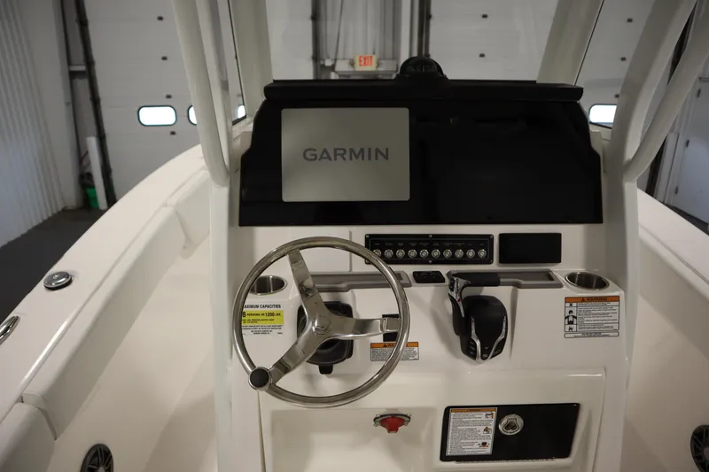 Slide: The Image of 2026 Sea Fox 228 Commander boat dashboard with Garmin navigation system and steering wheel. - 25