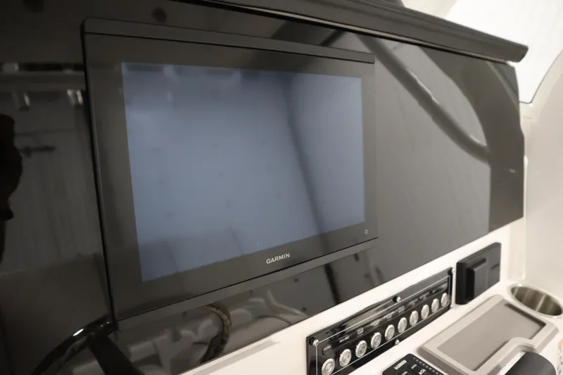 Slide: The Image of 2026 Sea Fox 228 Commander dashboard with Garmin display and control panel. - 29