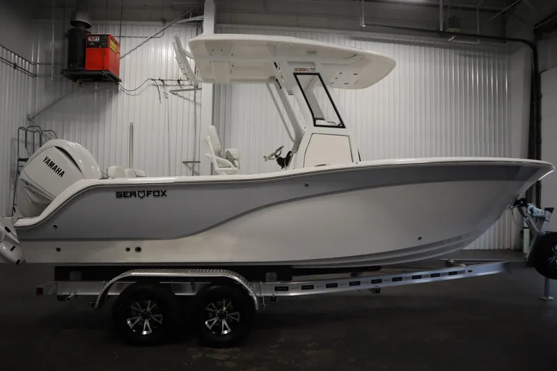 Slide: The Image of 2026 Sea Fox 228 Commander boat on trailer in indoor storage. - 3