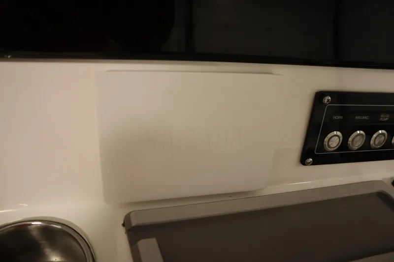 Slide: The Image of 2026 Sea Fox 228 Commander dashboard with control panel and cup holder. - 30