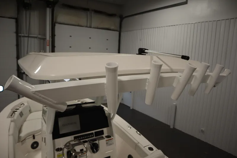 Slide: The Image of 2026 Sea Fox 228 Commander boat interior with rod holders and Garmin navigation system. - 40