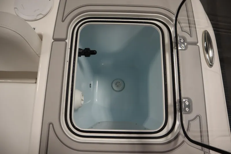 Slide: The Image of Livewell compartment on a 2026 Sea Fox 228 Commander boat, open lid view. - 42