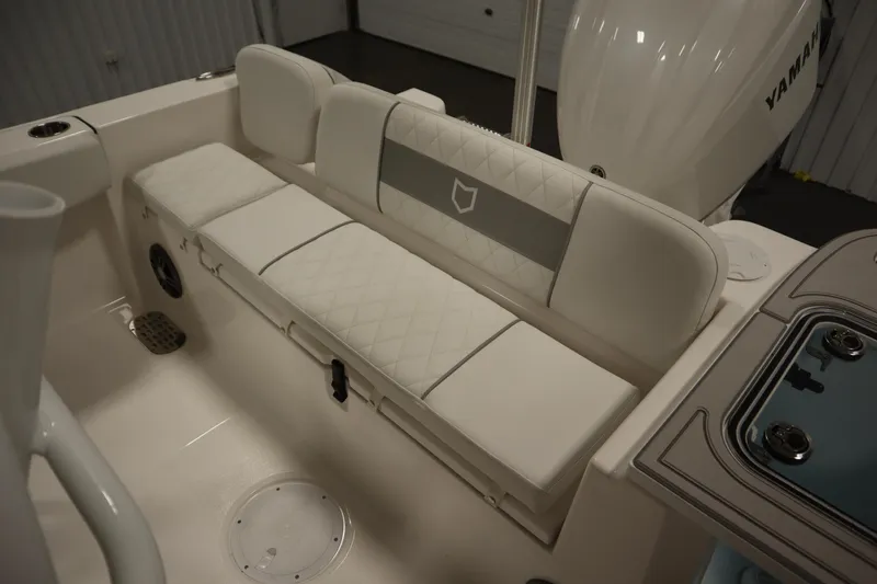 Slide: The Image of 2026 Sea Fox 228 Commander boat interior with cushioned seating and Yamaha engine. - 46