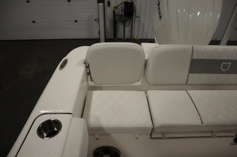 Slide: The Image of 2026 Sea Fox 228 Commander boat interior with cushioned seating and cup holder. - 48