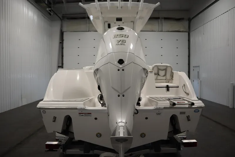 Slide: The Image of 2026 Sea Fox 228 Commander boat with powerful 250 V6 engine in a garage. - 5