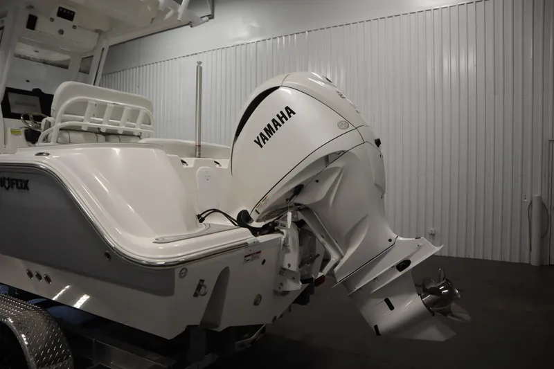 Slide: The Image of 2026 Sea Fox 228 Commander boat with Yamaha outboard motor in a showroom. - 51
