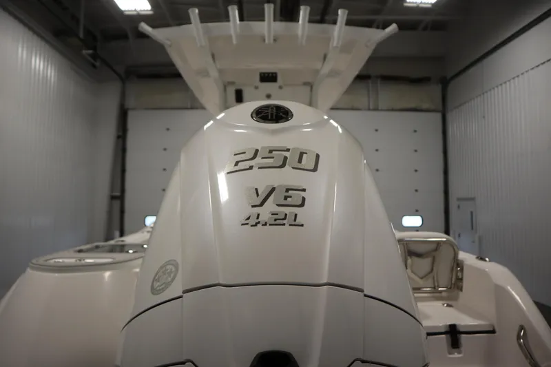 Slide: The Image of 2026 Sea Fox 228 Commander with 250 V6 4.2L engine in a garage. - 53