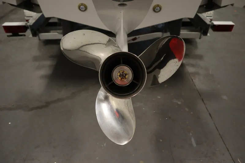 Slide: The Image of Close-up of a 2026 Sea Fox 228 Commander boat propeller in a garage setting. - 54