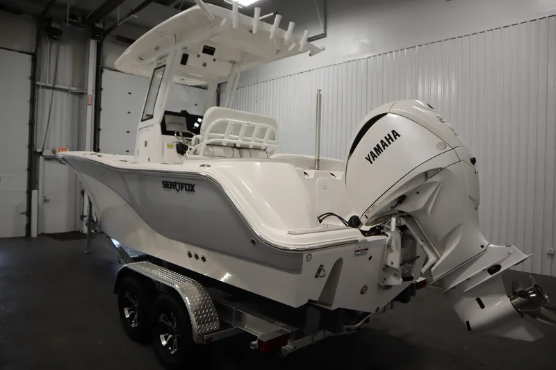 Slide: The Image of 2026 Sea Fox 228 Commander boat with Yamaha engine in indoor storage. - 6