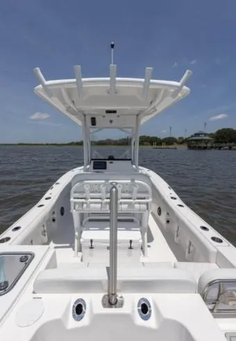 Slide: The Image of 2026 Sea Fox 228 Commander boat on calm water, featuring a spacious deck and modern design. - 65