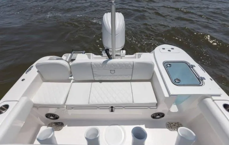 Slide: The Image of 2026 Sea Fox 228 Commander boat interior with white seating and storage compartments. - 69