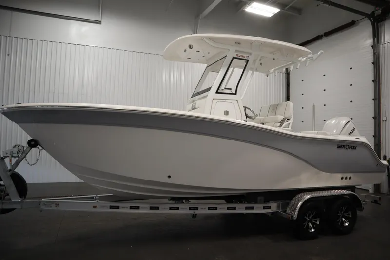 Slide: The Image of 2026 Sea Fox 228 Commander boat on trailer in indoor storage. - 7